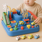 Child playing with a colorful toy race track set on a beige surface