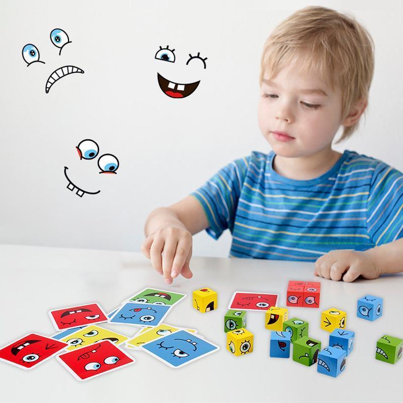 Child playing with colorful blocks and cards featuring cartoon faces on a white background