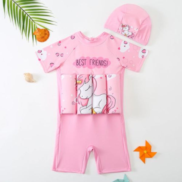 Pink children's swimsuit with unicorn design and matching cap on a white background