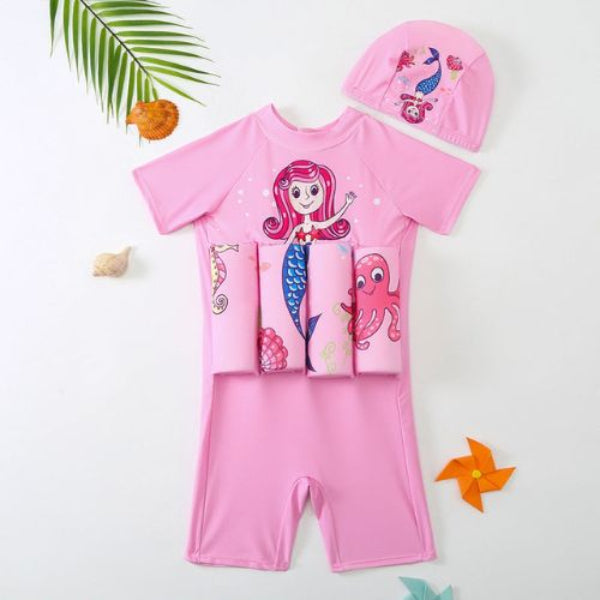 Pink children's swimsuit with mermaid design and matching cap on a white background