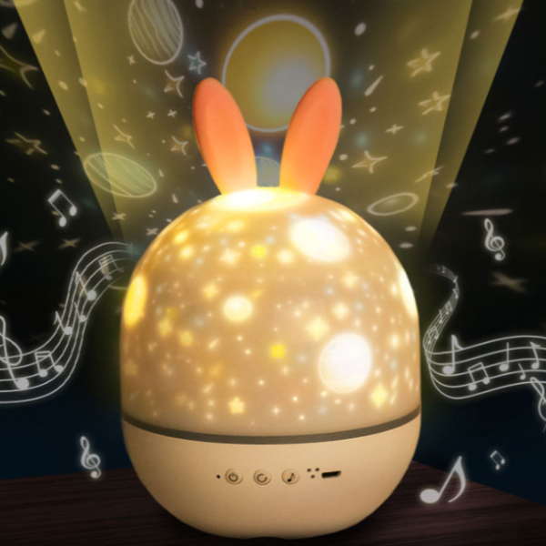 Children's night light with rabbit ears on a dark background with musical notes.