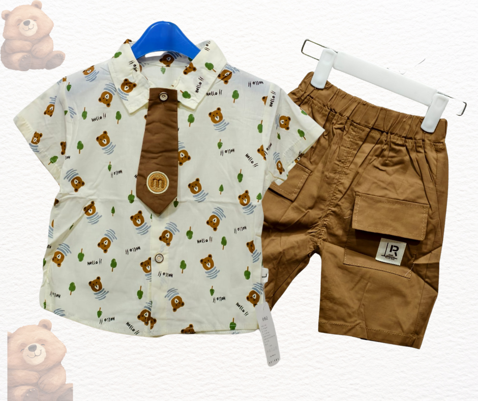 Children's shirt with bear pattern and shorts on hangers against a white background