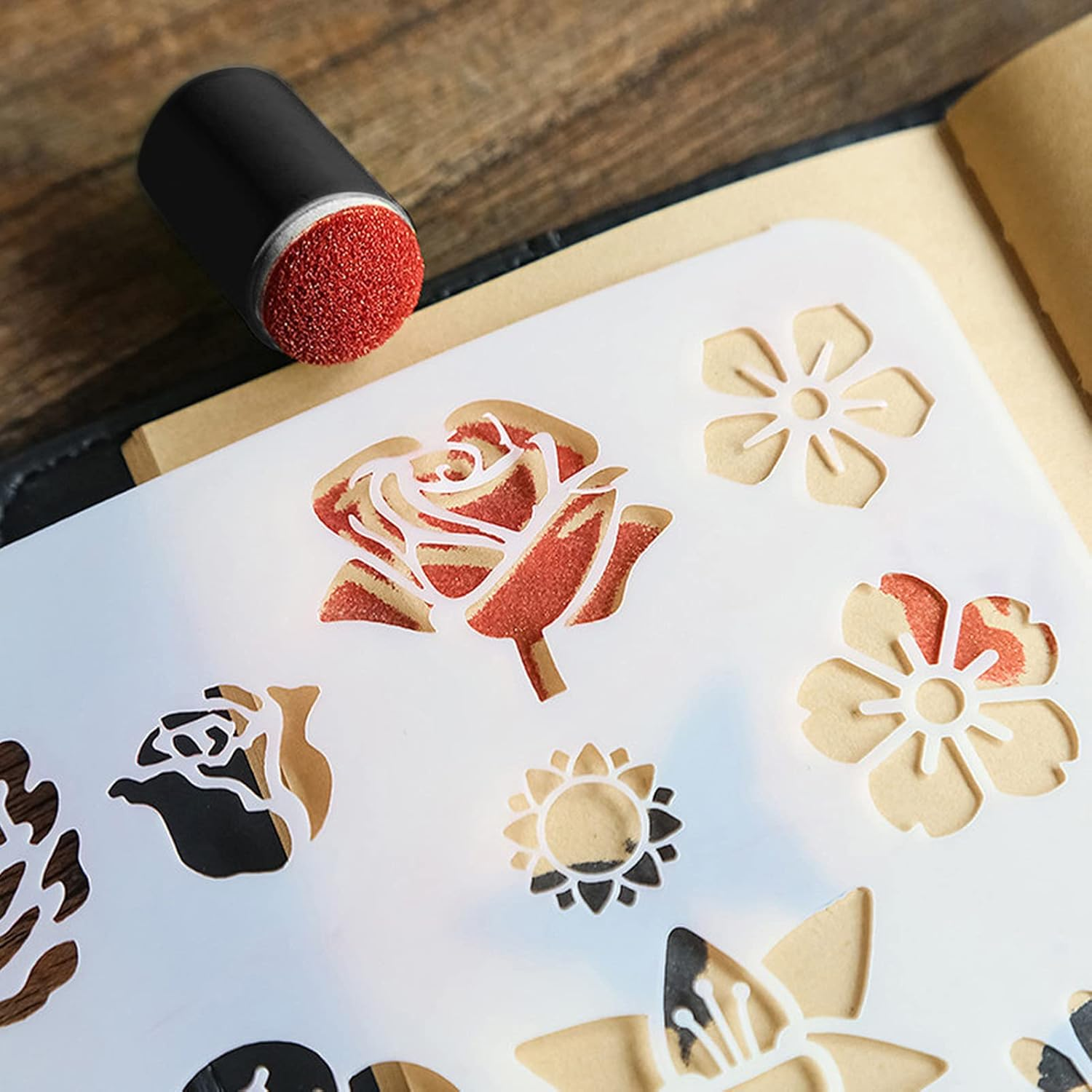 Decorative cookie cutters with floral designs on a wooden surface