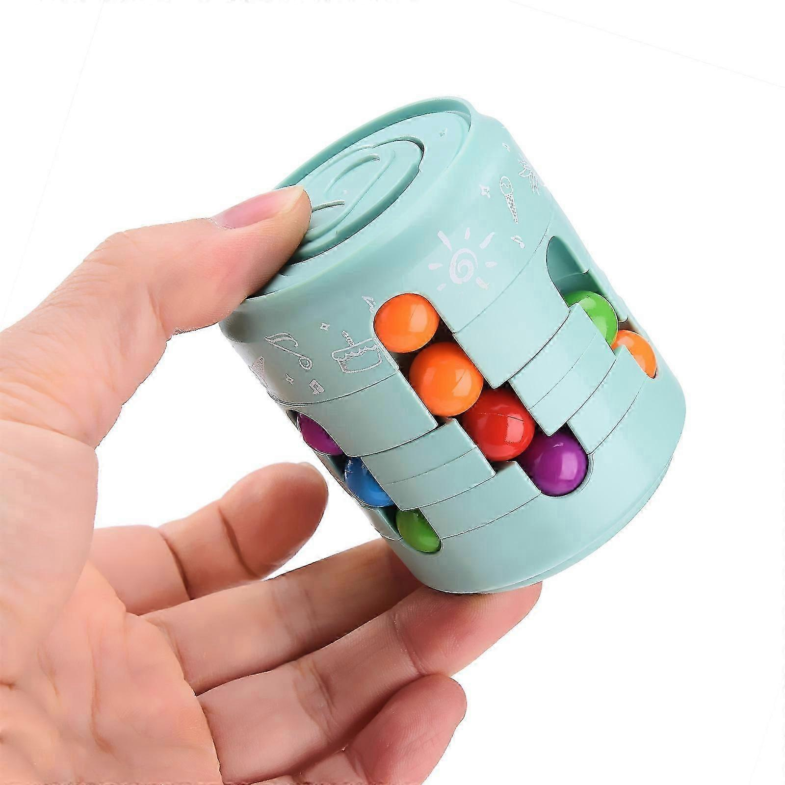 Hand holding a light blue puzzle toy with colorful beads on a white background