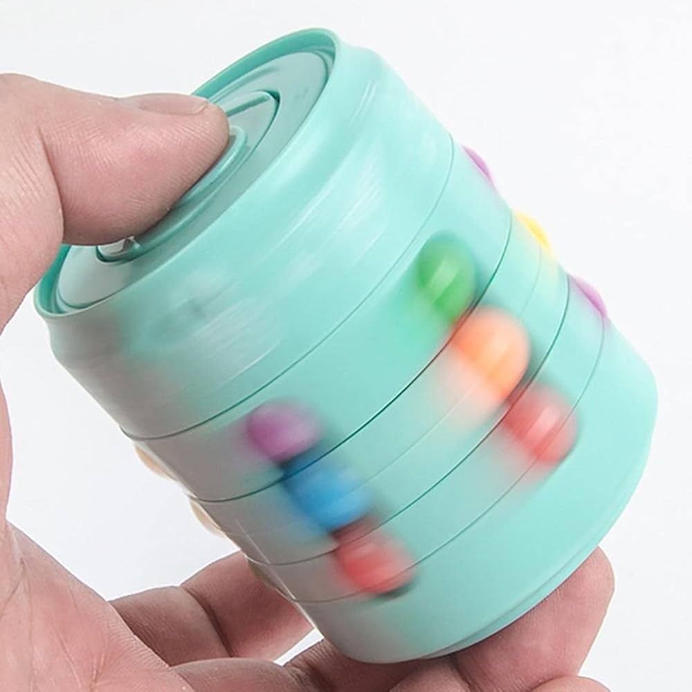 Colorful fidget spinner held in a hand against a white background