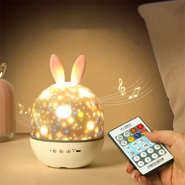 Bunny-shaped night light with remote control on a soft background