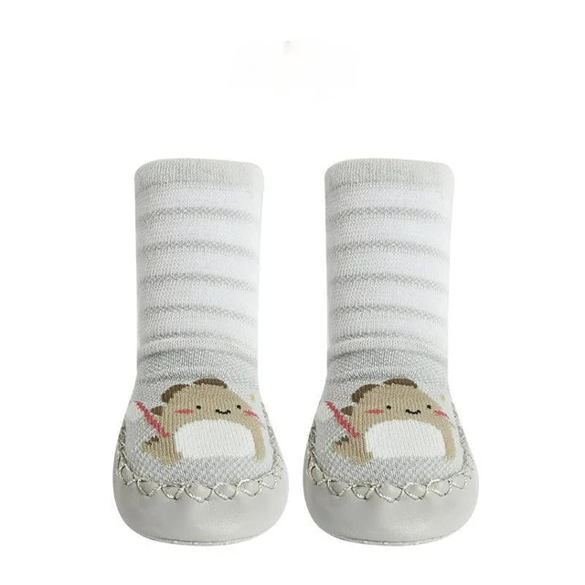 Pair of baby socks with hedgehog design on a white background
