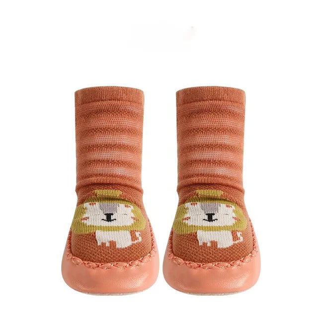 Pair of baby socks with lion design on a white background