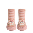 Pair of pink baby socks with cartoon cat design on a white background