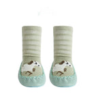 Pair of green baby socks with paw print design on a white background