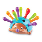 Colorful hedgehog toy with movable spines on a white background