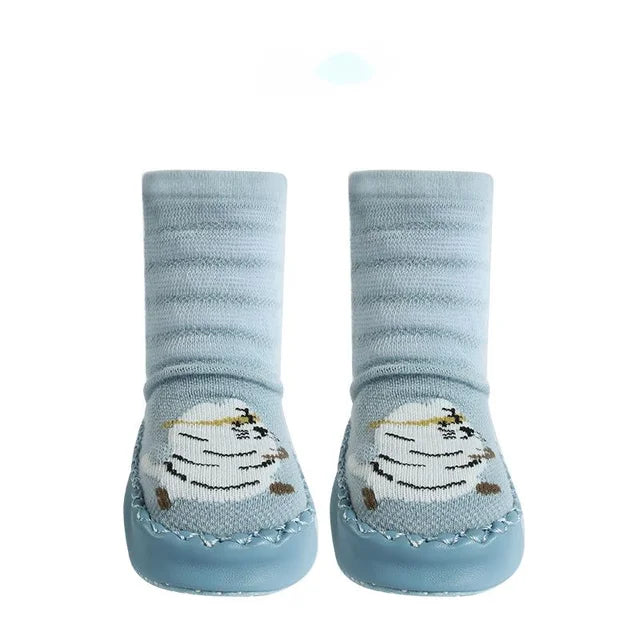 Pair of baby socks with cartoon design on a white background