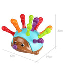 Colorful hedgehog toy with spike-like extensions on a white background