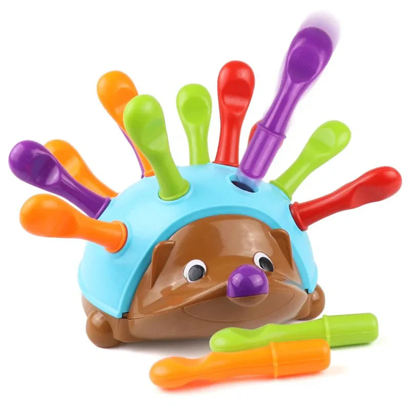Colorful hedgehog toy with extendable arms on a white background