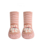 Pair of pink baby socks with cartoon cat design on a white background