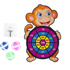 Children's dartboard with monkey design and three darts on a white background