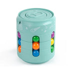 Turquoise cylindrical toy with colorful balls on a white background