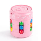 Pink cylindrical toy with colorful beads on a white background